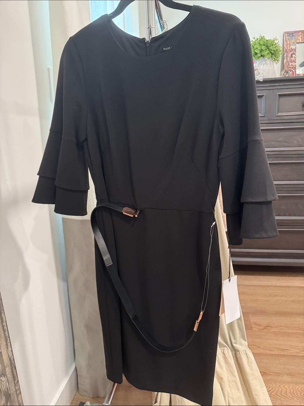 Black fitted dress. 3/4 sleeves. Belted. NVT. Includes belt.